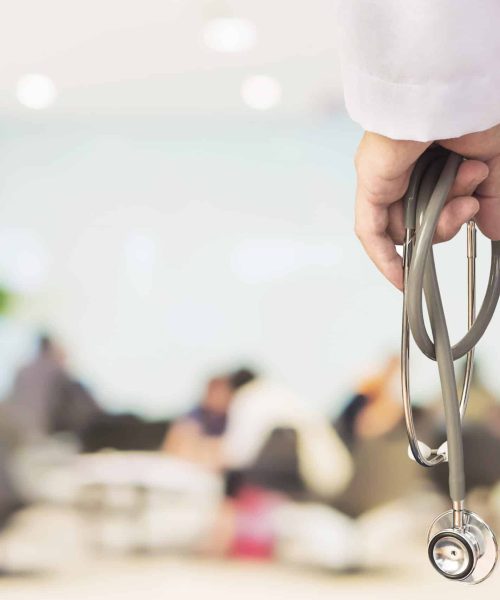 doctor-is-going-examine-his-patient-using-his-stethoscope-sitting-people Doctor is going to examine his patient using his stethoscope over sitting people in modern hospital background